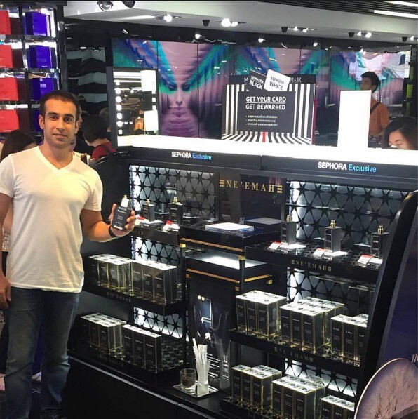 4_Mohammed Neyemah with perfumes.jpg